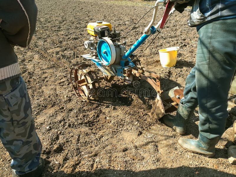 The farmer plows the soil. stock photo. Image of latin - 112500336