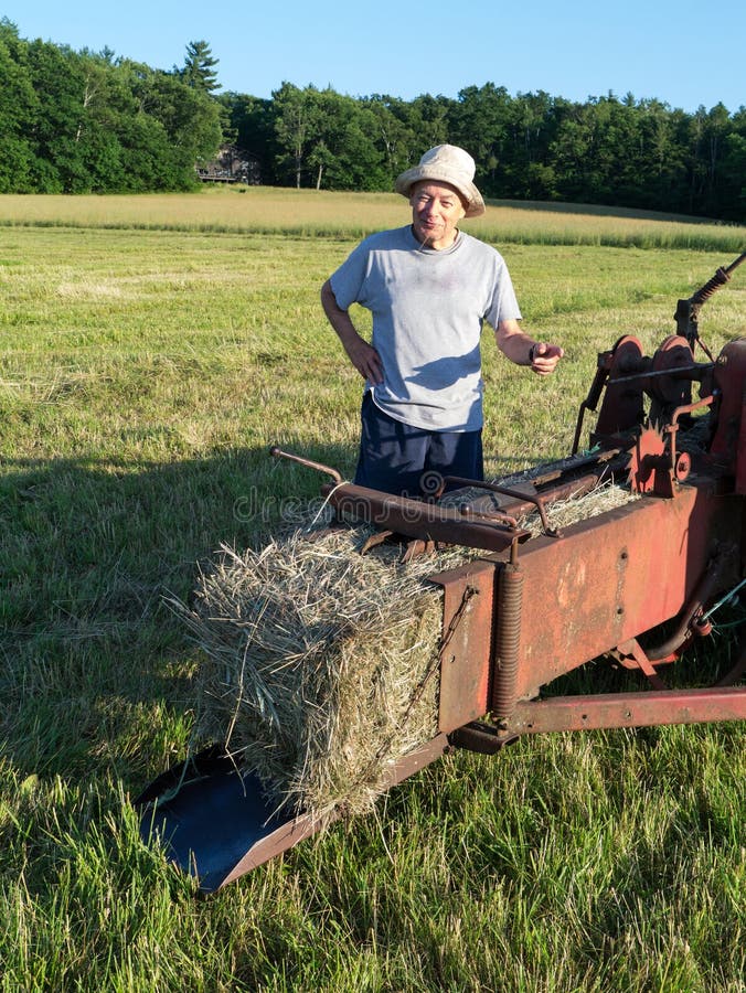 Farmer Making Hay Bales stock image. Image of senior 25569033