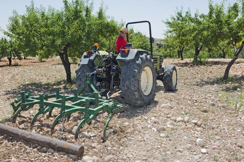 Farmer Plowing Field With Tractor royalty free stock images