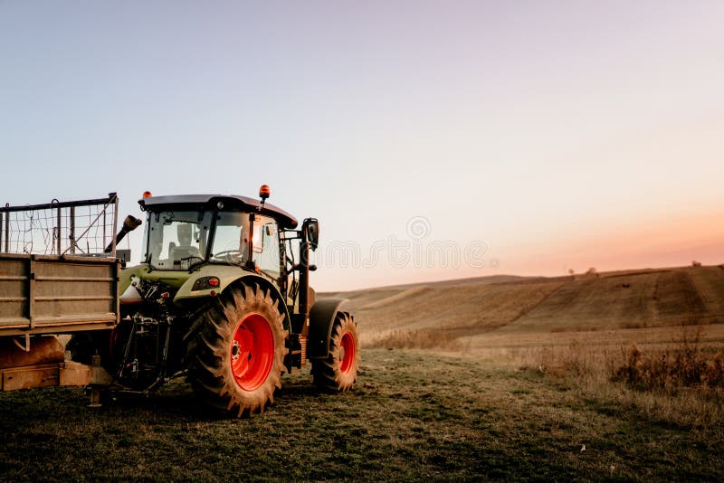 Farmer using modern tractor for harvesting royalty free stock photography