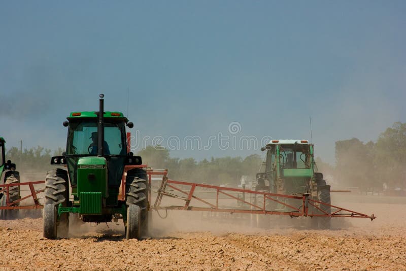 Farmers plowing the field stock photo