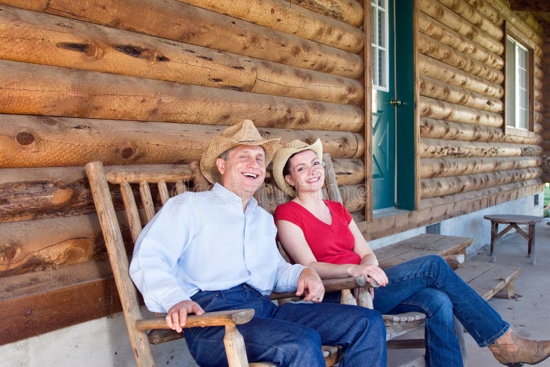 Farmers Sitting Outside of Cabin - horizontal