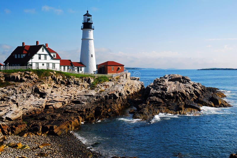 The Portland Head Lighthouse sits along the rocky coast of Maine. The Portland Head Lighthouse sits along the rocky coast of Maine