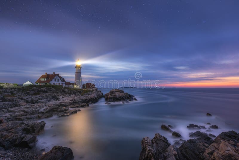 Morning clouds and late night stars pass over Portland Head Lighthouse at Fort Williams Park in Maine. Morning clouds and late night stars pass over Portland Head Lighthouse at Fort Williams Park in Maine.