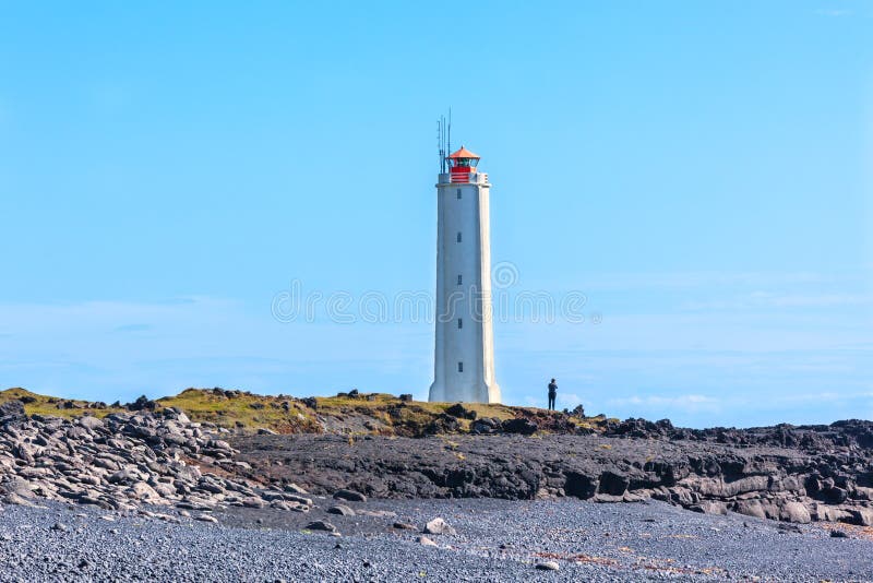 Faro in Islanda ad ovest a tempo soleggiato fotografie stock libere da diritti Faro in Islanda ad ovest a tempo soleggiato fotografie stock libere da diritti