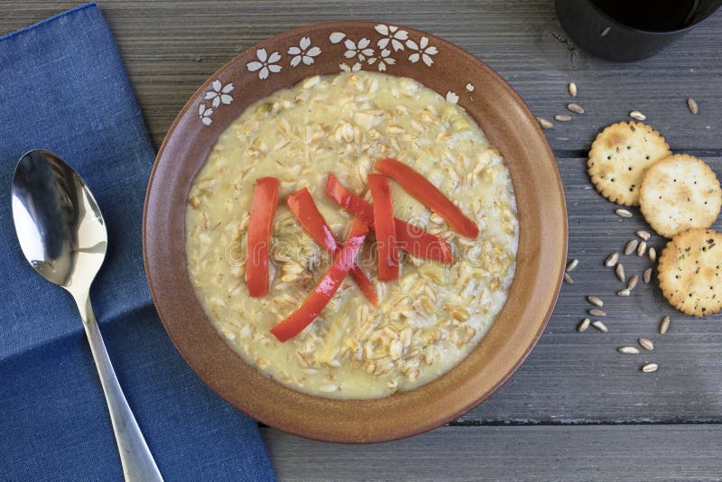 Farro grain soup dressed with red peppers