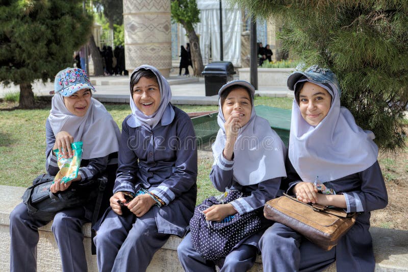 Schoolgirls Rest In Garden They Dressed In Islamic School Uniforms