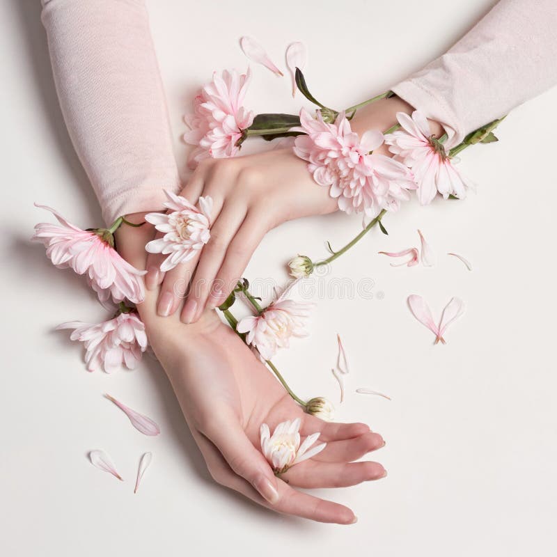 Fashion art portrait woman in summer dress and flowers in her hand with a bright contrasting makeup. Creative beauty photo girls