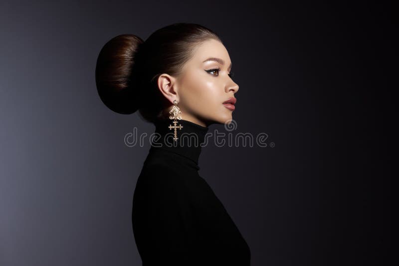 Fashion art studio portrait of beautiful elegant woman in black turtleneck. Hair high beam, perfect profile face. Elegant beauty