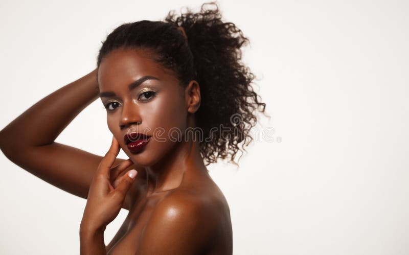 Fashion and beauty concept: attractive african american woman closeup portrait