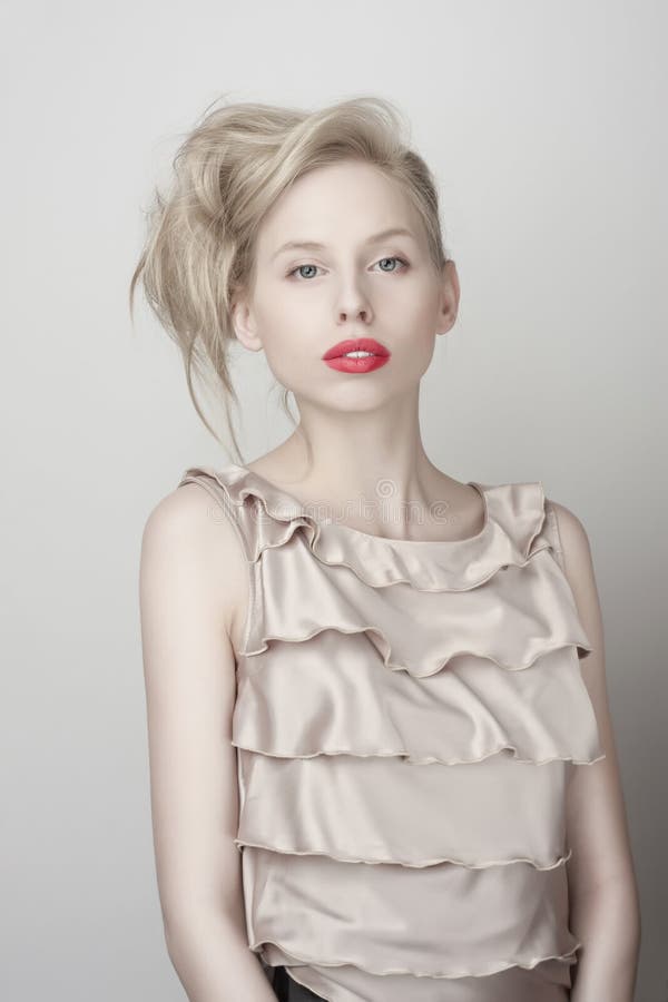 Fashion blond girl with red lips