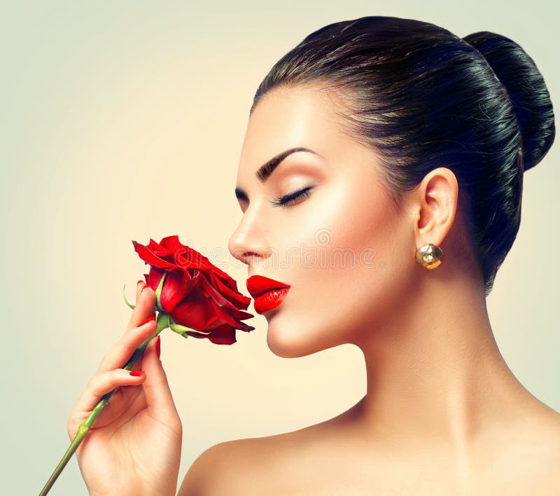 Fashion brunette model girl with red rose