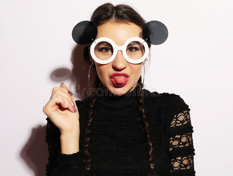 Fashion concept. Beauty surprised fashion model girl wearing big sunglasses. Young girl. Makeup.