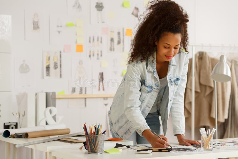 Fashion designer working in atelier royalty free stock image