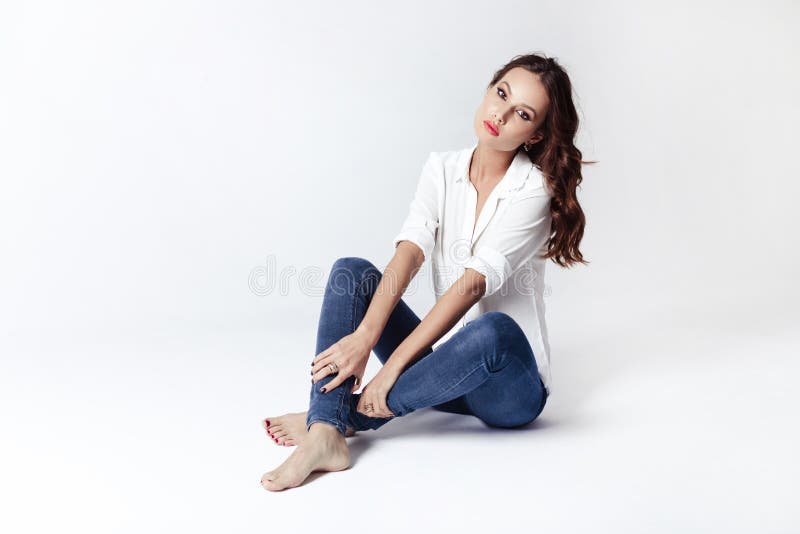 Fashion Model in a Blouse and Jeans Barefoot Stock Photo - Image of ...