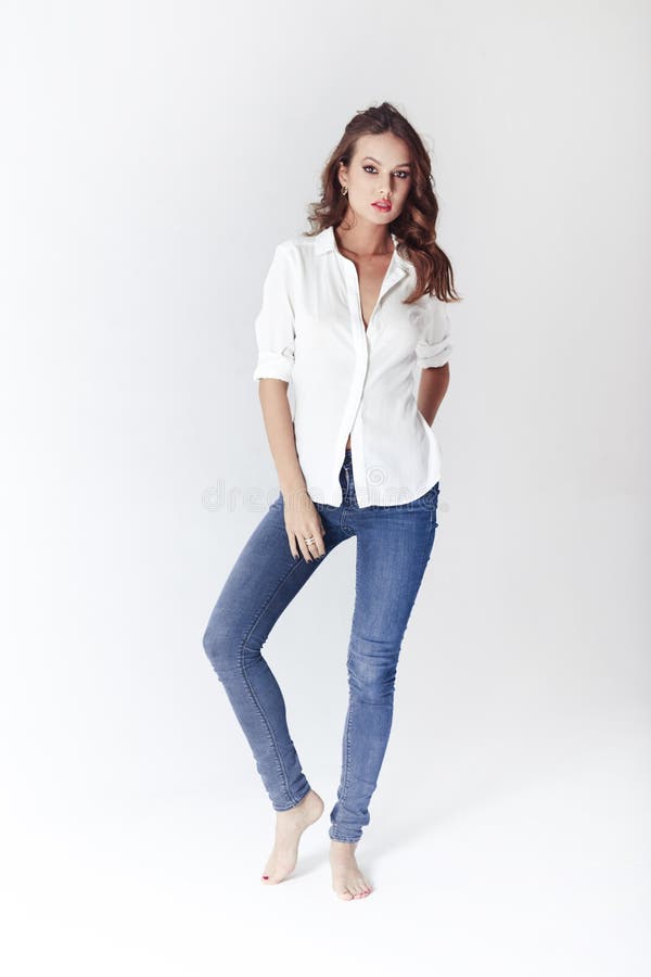 Fashion Model in a Blouse and Jeans Barefoot Stock Photo - Image of ...