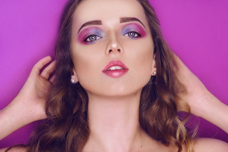 Fashion model with creative pink and blue make up. Beauty art portrait of beautiful girl with colorful abstract makeup. Beautiful stock photography Fashion model with creative pink and blue make up. Beauty art portrait of beautiful girl with colorful abstract makeup. Beautiful stock photography