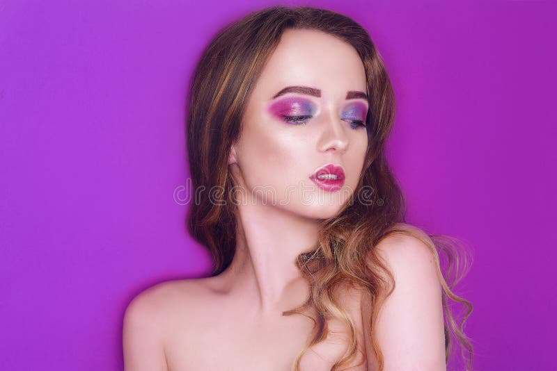 Fashion model with creative pink and blue make up. Beauty art portrait of beautiful girl with colorful abstract makeup. Beautiful stock image Fashion model with creative pink and blue make up. Beauty art portrait of beautiful girl with colorful abstract makeup. Beautiful stock image