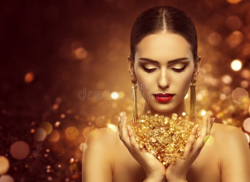 Fashion Model Holding Gold Jewelry in Hands, Woman Golden Beauty