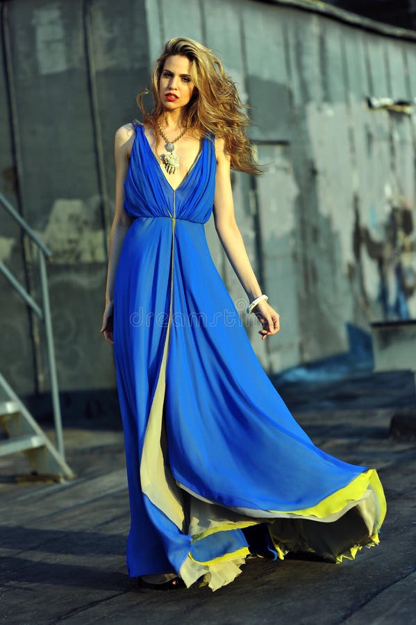 Fashion Model Posing Sexy Wearing Long Blue Evening Dress