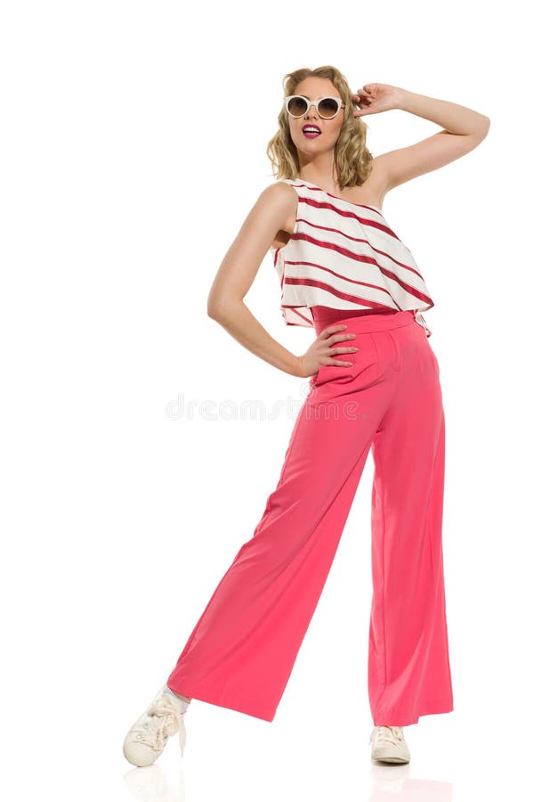 Fashion Model In Red Wide Leg Trousers And Sunglasses stock photography Fashion Model In Red Wide Leg Trousers And Sunglasses stock photography