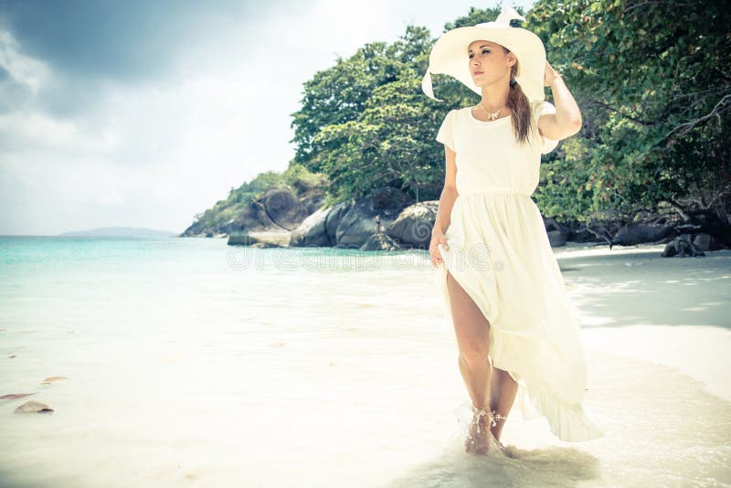 Fashion model on tropical beach