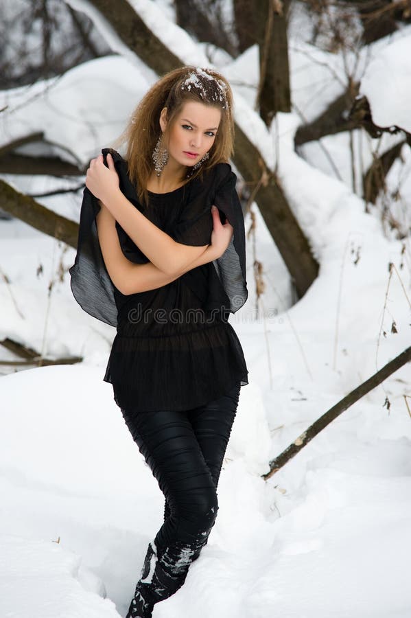 Fashion model in winter wood