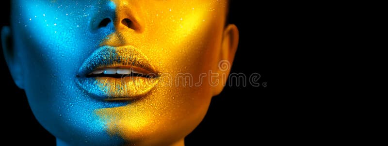 Fashion model woman face in bright sparkles, colorful neon lights, beautiful sexy girl lips. Trendy glowing gold skin makeup