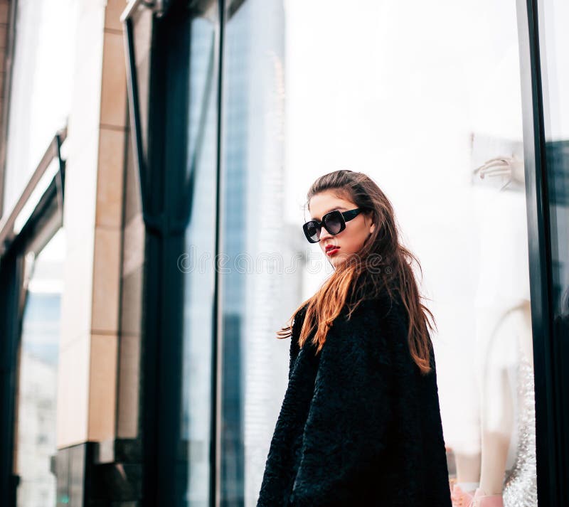 Fashion photo of beautiful young woman with sunglasses. Model looking at camera. City lifestyle. Female fashion. royalty free stock photo Fashion photo of beautiful young woman with sunglasses. Model looking at camera. City lifestyle. Female fashion. royalty free stock photo