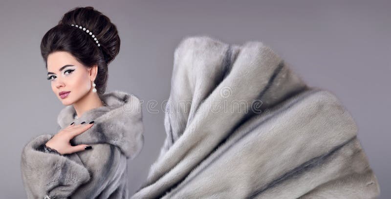 Fashion photo of woman in mink fur coat. Elegant brunette with m stock images Fashion photo of woman in mink fur coat. Elegant brunette with m stock images