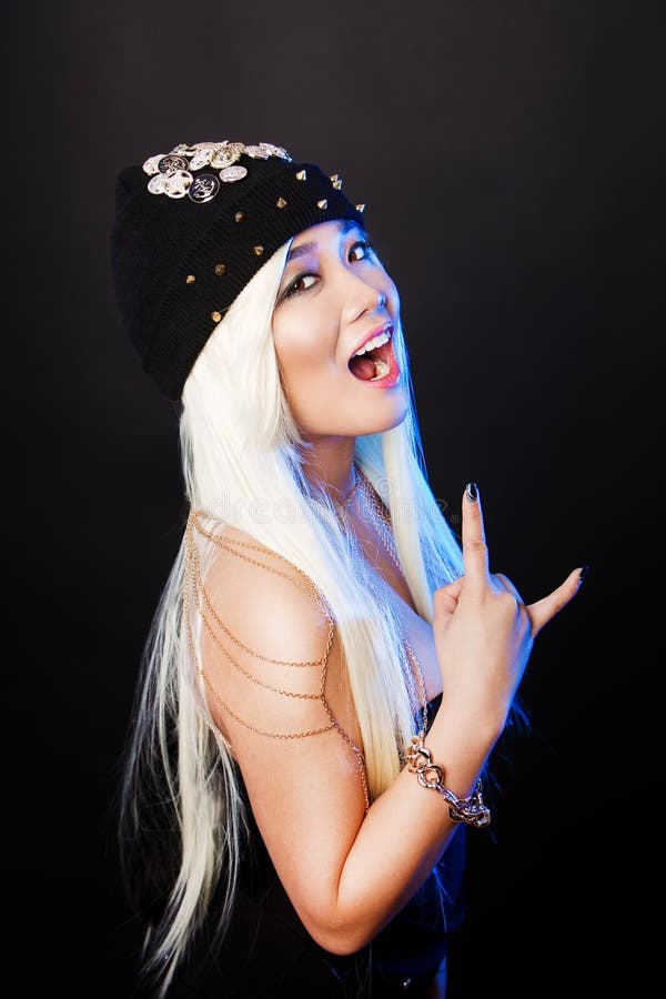 Fashion portrait of a asian girl in glamor rock stock image Fashion portrait of a asian girl in glamor rock stock image