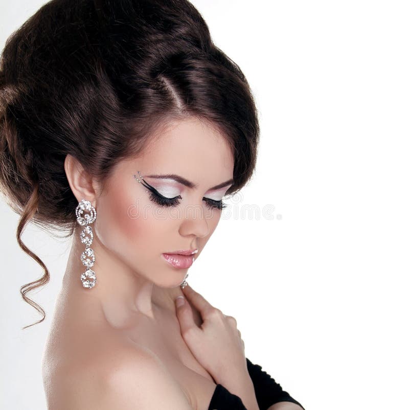 Fashion portrait of Beautiful woman with hairstyle and evening m