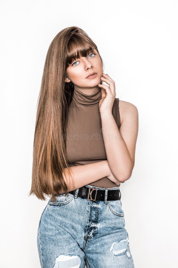 Fashion Portrait of Beautiful Young Girl with Smooth Hair. Girl in Blouse and Jeans. Clothing and Bangs Hairstyle Stock Photo - Image of lifestyle, caucasian: 175189732 Fashion Portrait of Beautiful Young Girl with Smooth Hair. Girl in Blouse and Jeans. Clothing and Bangs Hairstyle Stock Photo - Image of lifestyle, caucasian: 175189732