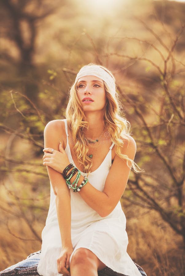 Fashion Portrait of Beautiful Young Woman Backlit at Sunset