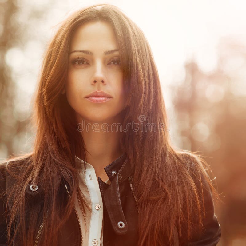 Fashion portrait of a beautiful young woman face - closeup