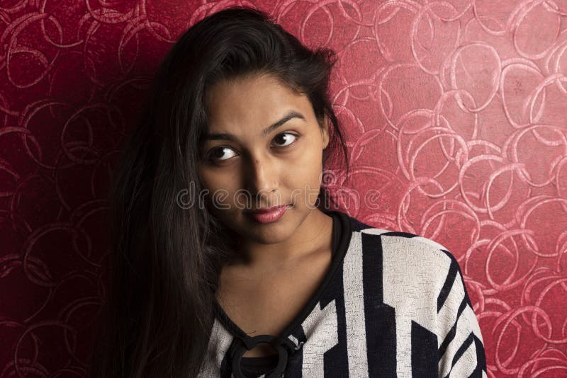 Fashion Portrait of an Indian Bengali Beautiful and Young Girl in Western Dress Standing in Front of a Red Textured Wall. Stock Image - Image of indian, adult: 188480841 Fashion Portrait of an Indian Bengali Beautiful and Young Girl in Western Dress Standing in Front of a Red Textured Wall. Stock Image - Image of indian, adult: 188480841