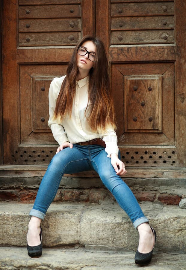 Fashion portrait stylish urban girl posing in old city street stock images Fashion portrait stylish urban girl posing in old city street stock images