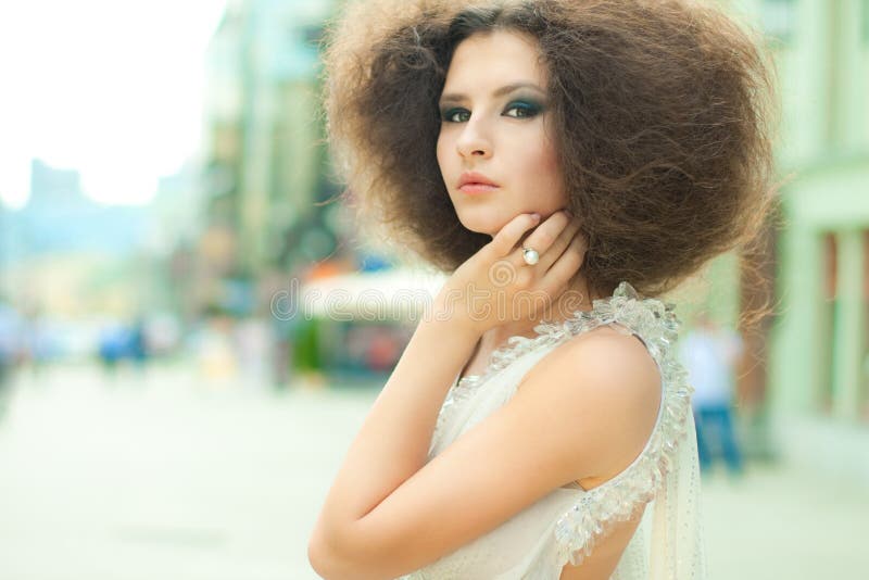 Fashion portrait of a young woman on a street