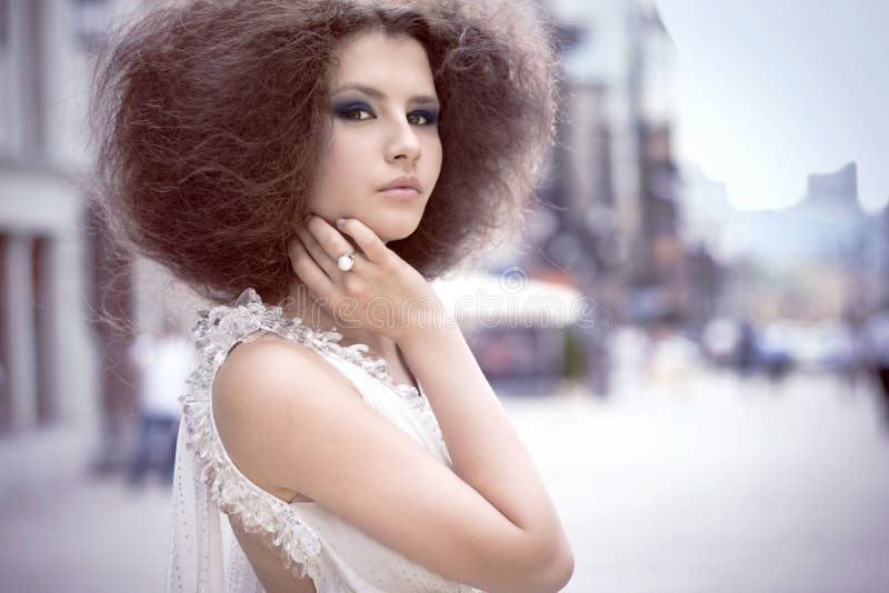 Fashion portrait of a young woman on a street