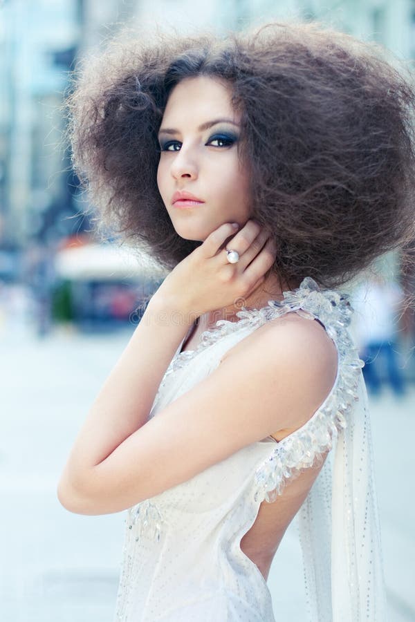 Fashion portrait of a young woman on a street