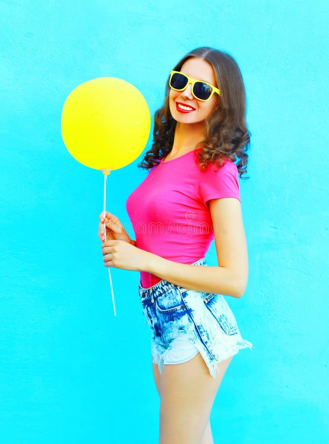 Fashion Pretty Smiling Young Woman Wearing a T-shirt, Denim Shorts with ...