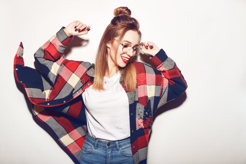 Fashion pretty young woman in glasses over white background. Lifestyle and people concept. Having fun, dance, fly.