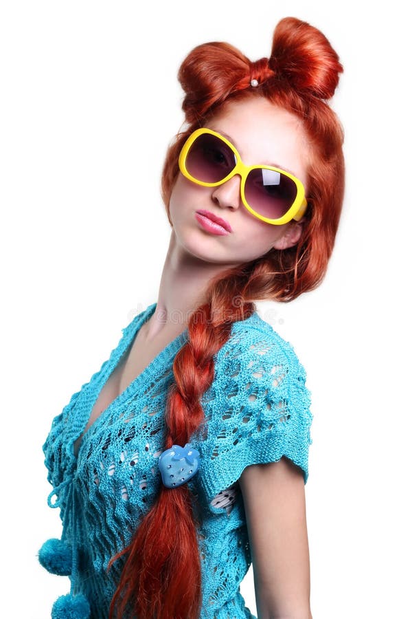 Fashion red-haired woman in a stylish glasses