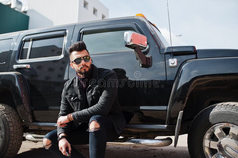 Fashion Rich Beard Arab Man Wear On Black Jeans Jacket And Sunglasses Posed  Against Big Black Suv Car. Stylish, Succesful And Stock Image - Image Of  City, Jeans: 228863937