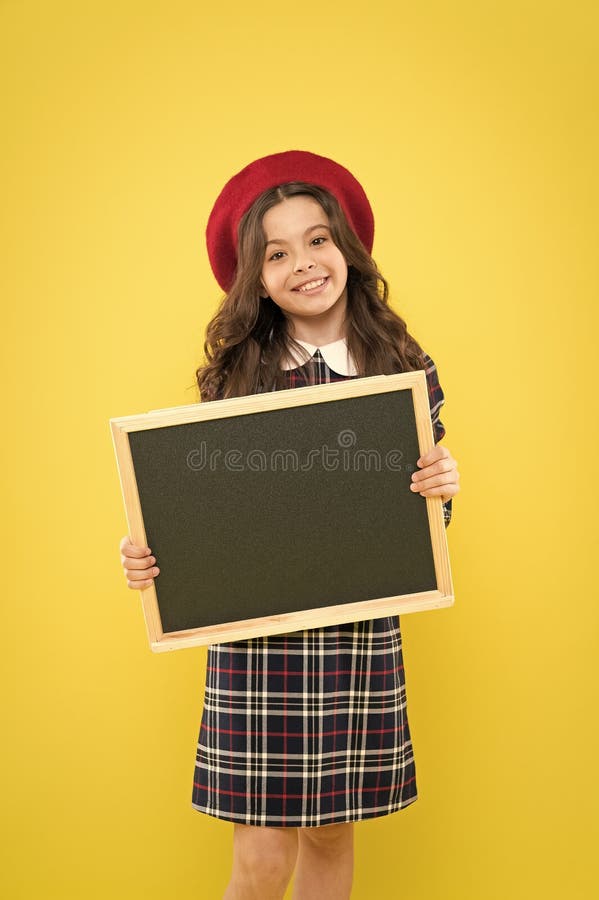 Fashion sales. parisian child on yellow background. happy girl with long hair in beret. small girl in french beret royalty free stock image Fashion sales. parisian child on yellow background. happy girl with long hair in beret. small girl in french beret royalty free stock image