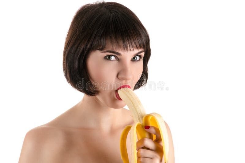 Fashion woman eating banana. 