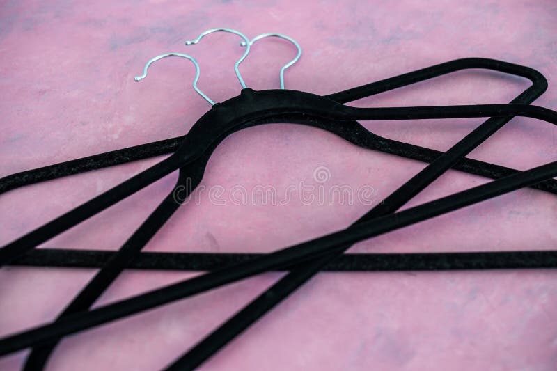Fashion and shopping, group of clothes hangers creating geometric shape on pink background royalty free stock photos Fashion and shopping, group of clothes hangers creating geometric shape on pink background royalty free stock photos