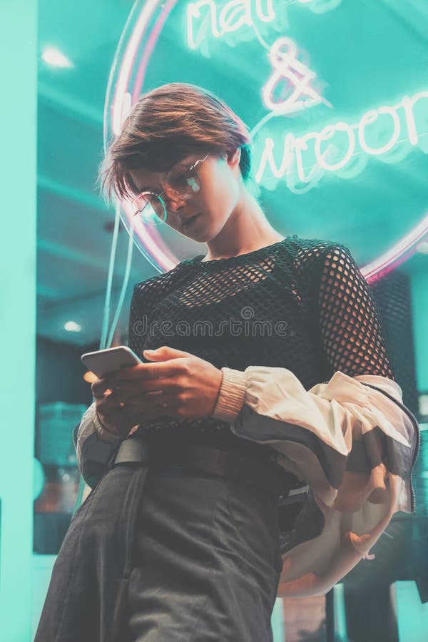 Fashion Teen Hipster Girl Stand Near Neon Sign in Night City Using Phone Apps Stock Image - Image of clothes, fashion: 160101671 Fashion Teen Hipster Girl Stand Near Neon Sign in Night City Using Phone Apps Stock Image - Image of clothes, fashion: 160101671