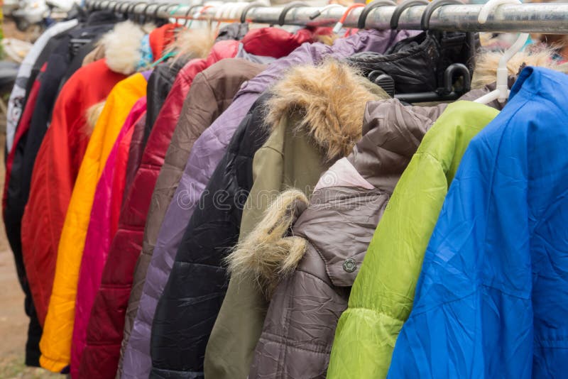 Fashion winter coats hanged on a clothes rack