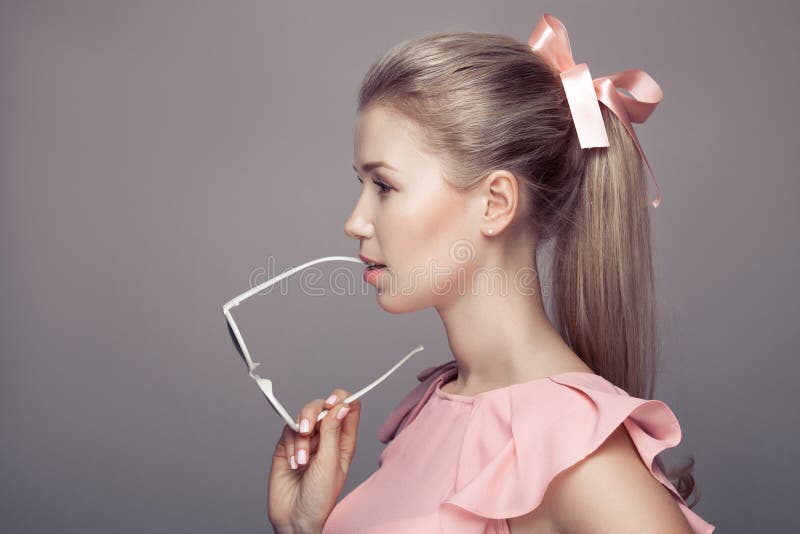 Fashion Woman Holding Sunglasses In Hand. stock images Fashion Woman Holding Sunglasses In Hand. stock images